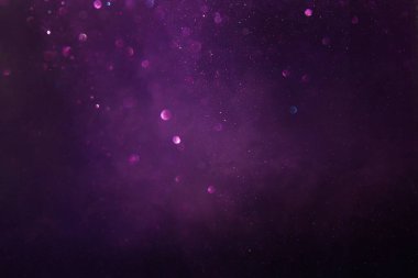 Soyut parıltılı ışıkların arkaplanı. Altın, mavi ve mor. & Odaklan