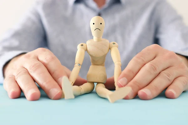 Male Hand Holding Wooden Dummy Sad Face Concept Anxiety Stress — Stock Photo, Image