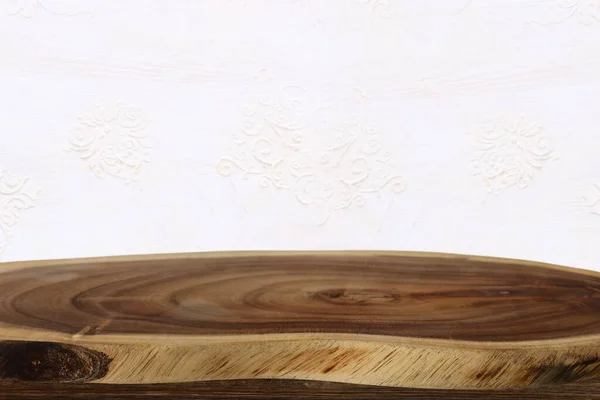 background Image of vintage table in front of old white decorative wooden wall. ready for product display