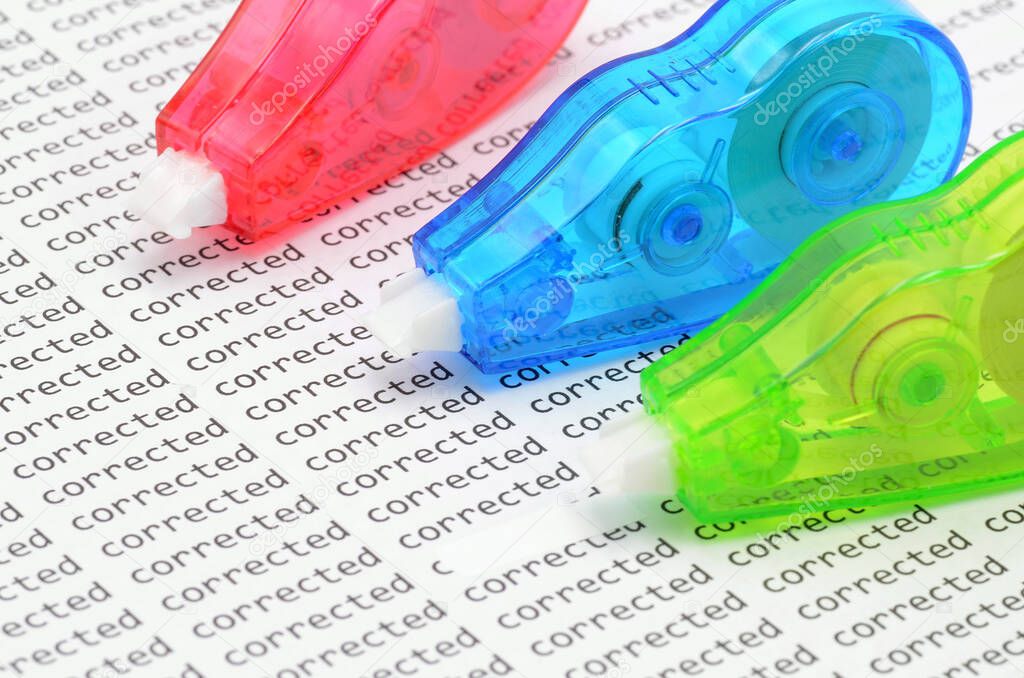 colored text correctors on paper sheet