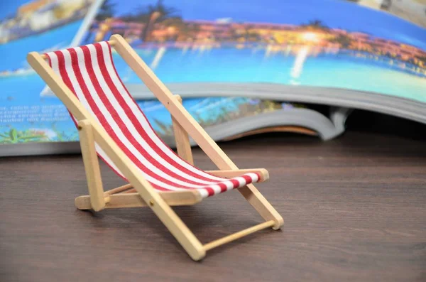 beach chair with travel magazines