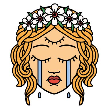 Üçüncü gözü ve taç takan geleneksel kadın yüzü dövmesi.