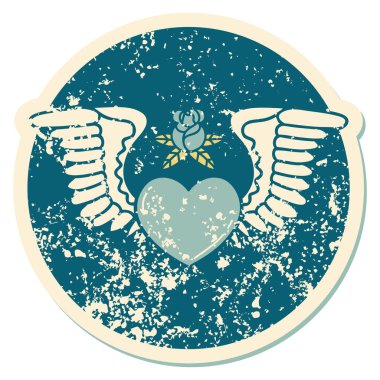 Kanatlı bir kalbin sembolik dövmesi.