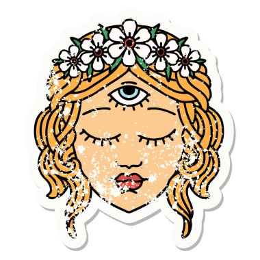 Geleneksel bir kadın yüzü stili, üçüncü gözü ve çiçek tacıyla dövmesi var.