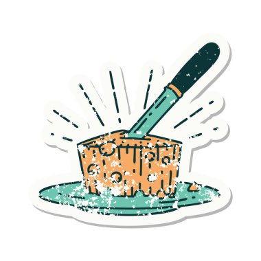 Bir tabak peynirin eski bir çıkartması.