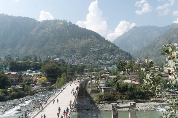 Landscape scenery of Kullu capital City, the famous Indian resort town state. Located on bank of Beas River a popular tourist destinations and hill stations in India. Kulu, Himachal Pradesh, July 2019