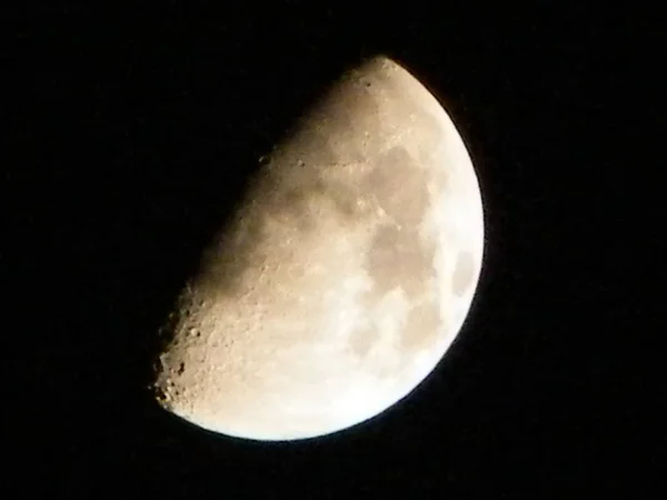 The Half moon hemisphere lunar phase(Earth is between the Sun and the Moon) - Moon appears fully illuminated from Earth perspective . Completely sunlit and appears like half disk. Black Background