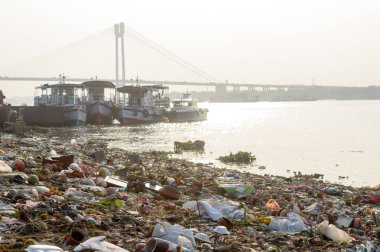Ganges Water Pollution Polluted holy Ganga with human waste, industrial leftovers, domestic sewage and religious rituals from towns cities poses threat to health environment. Kolkata India May 2019