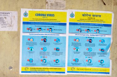 Coronavirus Güvenlik Farkındalığı Hastalık Kontrol ve Önleme slogan posterinde sokak duvarında Coronavirus (COVID-19 / 2019-ncov), Orta Doğu Solunum Sendromu (MERS) ve SARs ile ilişkili Dos and Donts Uygulamalarını gösteren belirtiler yer alıyor. Kolkata 