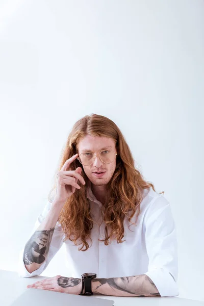 Pensive Stylish Tattooed Businessman Curly Hair Looking Camera Isolated White — Stock Photo, Image