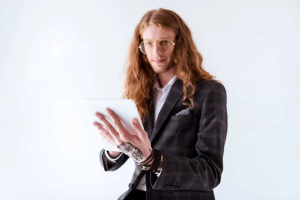 Stylish Tattooed Businessman Curly Hair Holding Tablet Isolated White — Free Stock Photo