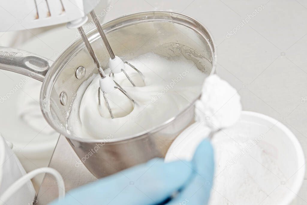 culinary workshop, whipping protein with sugar on a mixer