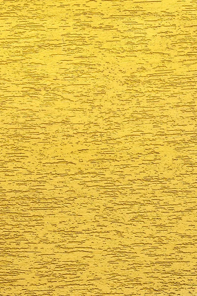 Κίτρινος στόκος. Η πρόσοψη του σπιτιού καλύπτεται με διακοσμητικό σοβά. Πλαίσιο υφής. — Φωτογραφία Αρχείου