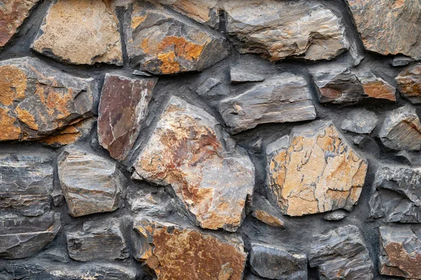 Stone wall. Close-up wall of wild stone. Stone background.