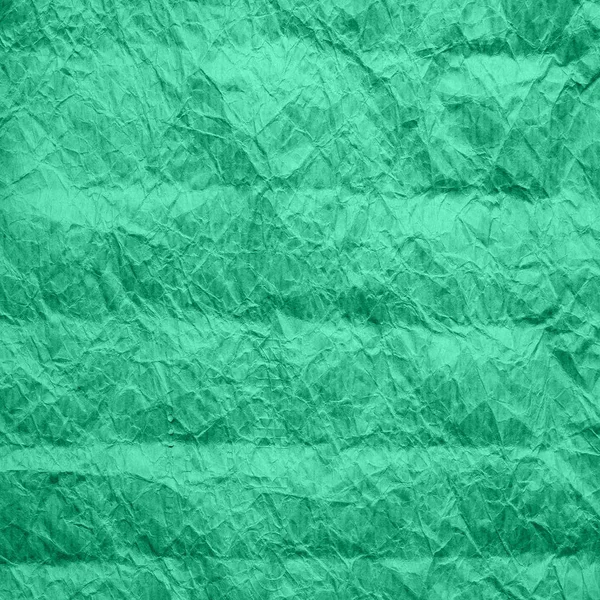 Мятный цвет оберточной бумаги. Текстура смятой крафтовой бумаги акваментного цвета. Переработанный бумажный фон . — стоковое фото