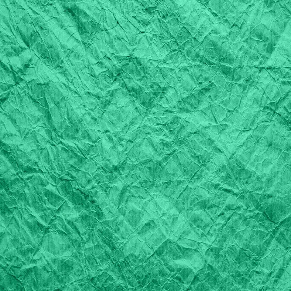 Mintfarbe des alten Packpapiers. die Textur von zerknittertem Kraftpapier Farbe aqua menthe. Hintergrund Altpapier. — Stockfoto