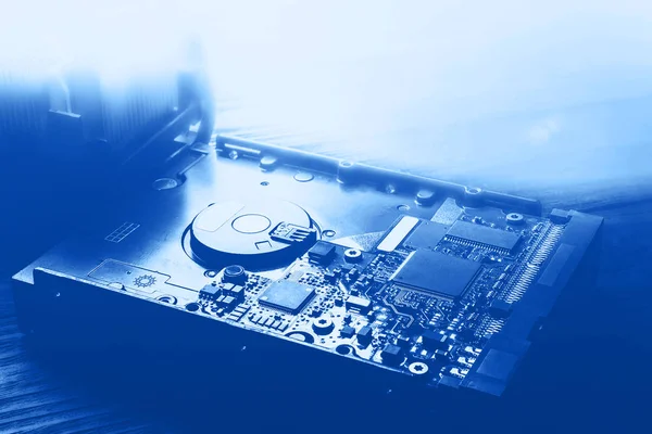 Hard disk. Blue toning a computer hard drive. Microchips and PC components, storage data and information recovery. — Stok fotoğraf