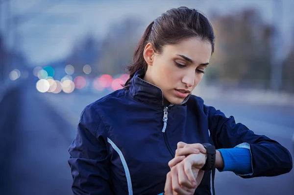 Jogger checking smart watch — Stock Photo, Image