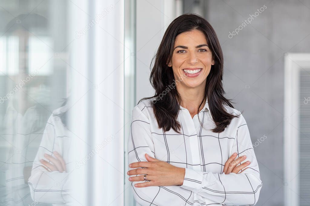 Successful mature business woman looking at camera