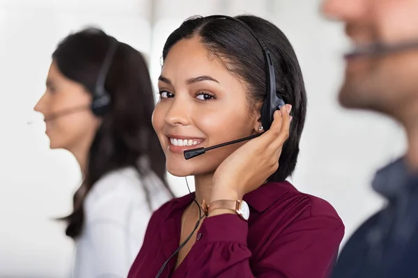 Young latin woman in customer service center — Stock Photo, Image