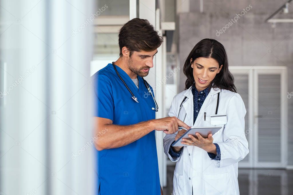 Doctor and nurse discussing report