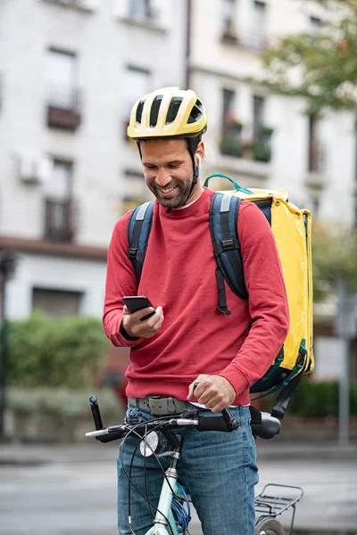 Delivery man using smartphone