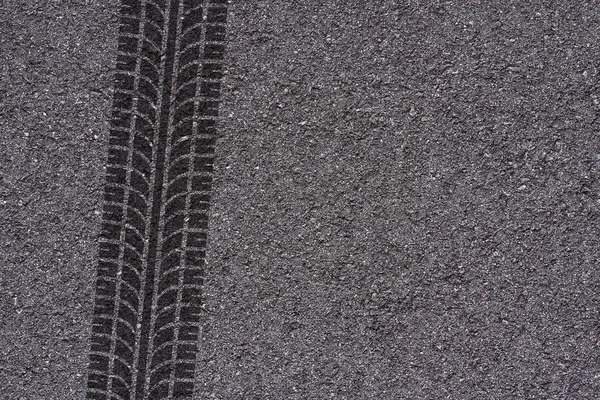 tire marks on asphalt background texture