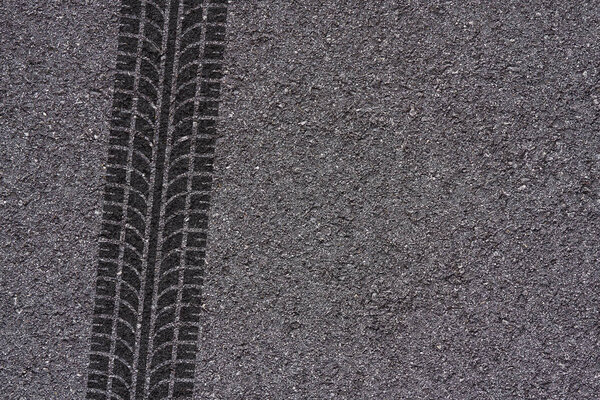 tire marks on asphalt background texture