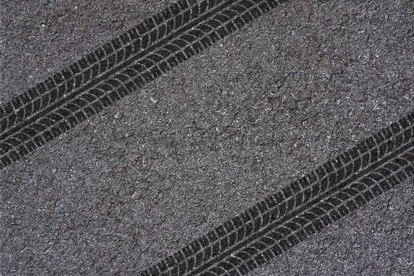 tire tread pattern on asphalt background