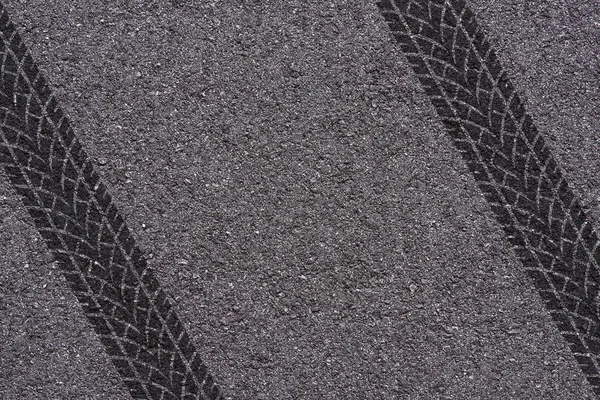 tire tread pattern on asphalt background