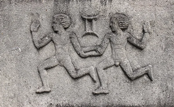 Zodiac - Grmini or Twins, a stone relief — Stock Photo, Image