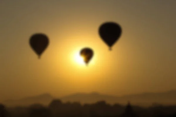 Oskärpa bakgrund - ballonger på soluppgången i Bagan, Myanmar — Stockfoto
