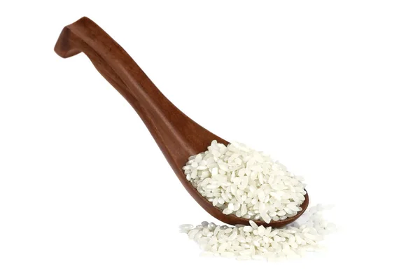 Milch arroz en una cuchara de madera (enfoque manual ) — Foto de Stock