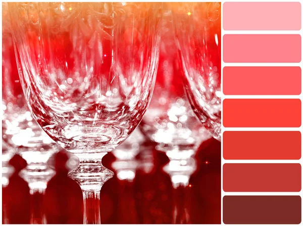 Color palette series: shades of reds - wine glasses under party lights — Stock Photo, Image