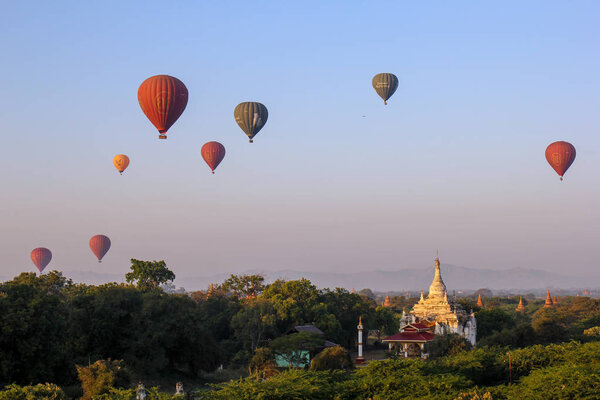 Hot air balloons riding over temples and stupas, Bagan, Myanmar