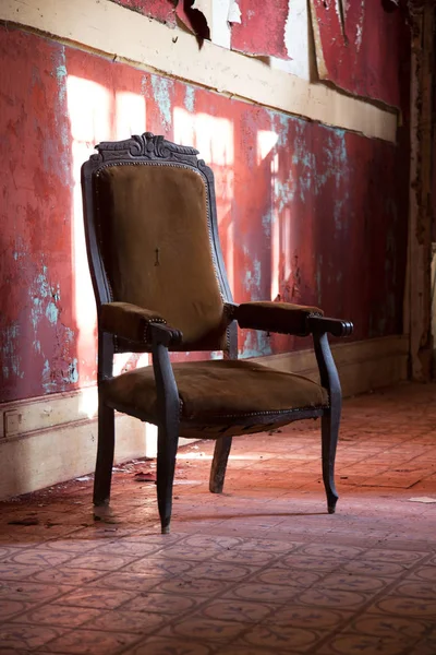 Old armchair in an abandoned house