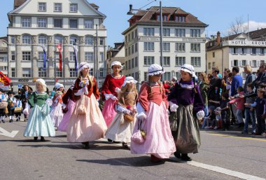 Zurich, Switzerland - 23. April 2017: Sechselauten parade. Sechselauten is a tradtional spring holiday in the city of Zurich to celebrate the winter end. It is participated by various groups from all parts of Switzerland. clipart