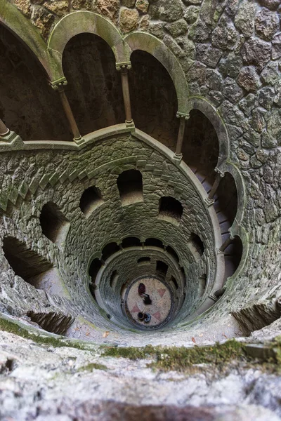 The Initiation well of Quinta da Regaleira in Sintra, Portugal. It\'s a 27 meter staircase that leads straight down underground and connects with other tunnels via underground