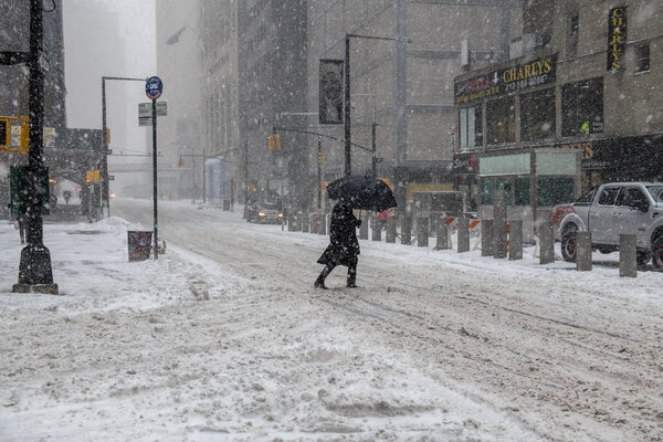 NEW YORK JANUARY 4: A snow filled street scene during the Bomb Cyclone on January 4 2018 in lower Manhattan.