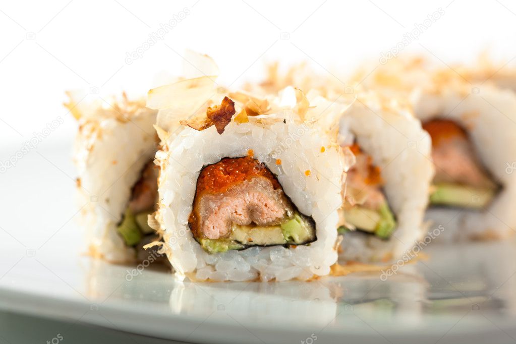 Salmon Skin Maki Sushi - Roll with Salmon Skin, Cucumber and Avocado inside. Grilled Sliced Tuna outside