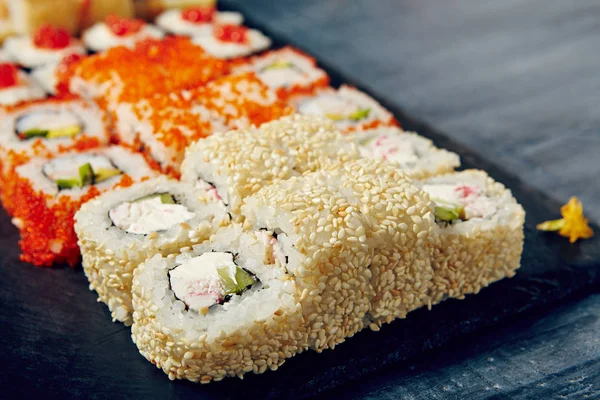 Menu of Japanese sushi rolls on black background — Stock Photo, Image