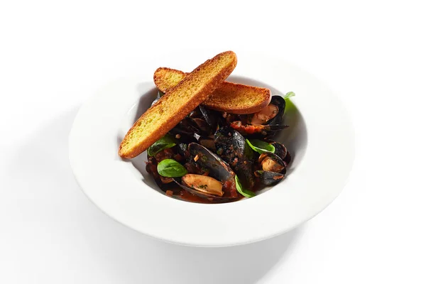 Mussel in red spicy sauce — Stock Photo, Image