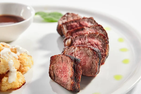 Beef steak with cauliflower dish top view