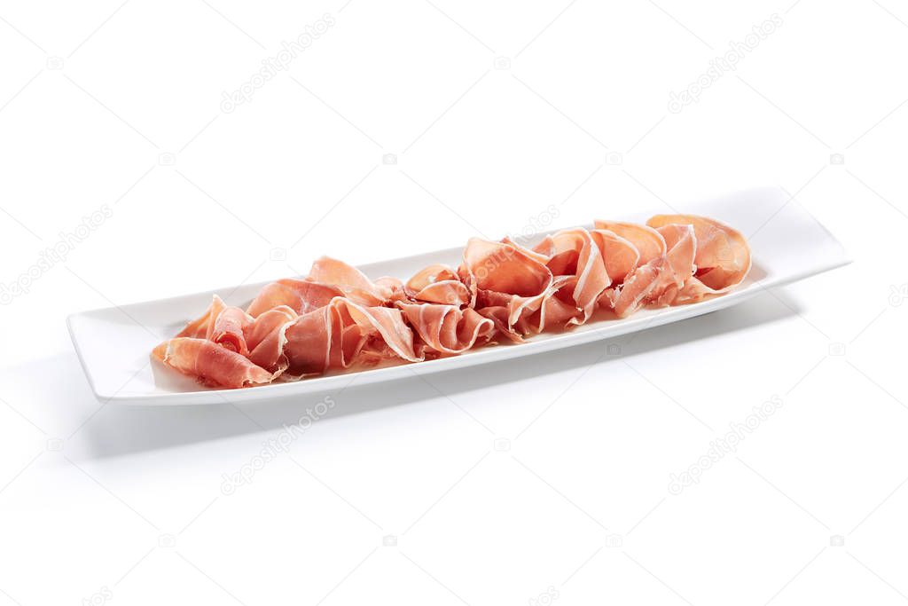 Sliced Jamon Iberico, Prosciutto or Speck on Restaurant Plate Is