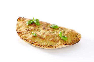 Traditional Italian whole calzone pizza with ham, cheese and tomatoes isolated on white background. Oven-baked folded kalzone stuffed with salami, vegetables, mozzarella, ricotta and parmesan cutout clipart