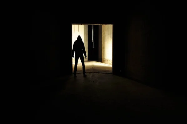Silhouette of hooded person — Stock Photo, Image
