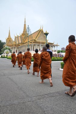 Monks tour the Royal Palace in Phnom Penh, Cambodia clipart