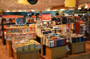 Customers shop for books in Changi Airport, Singapore clipart