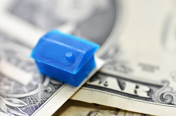 Little plastic house on US dollar banknote — Stock Photo, Image