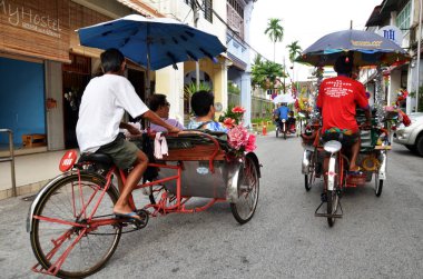 Geleneksel çekçek sürücüsü Penang, Malezya